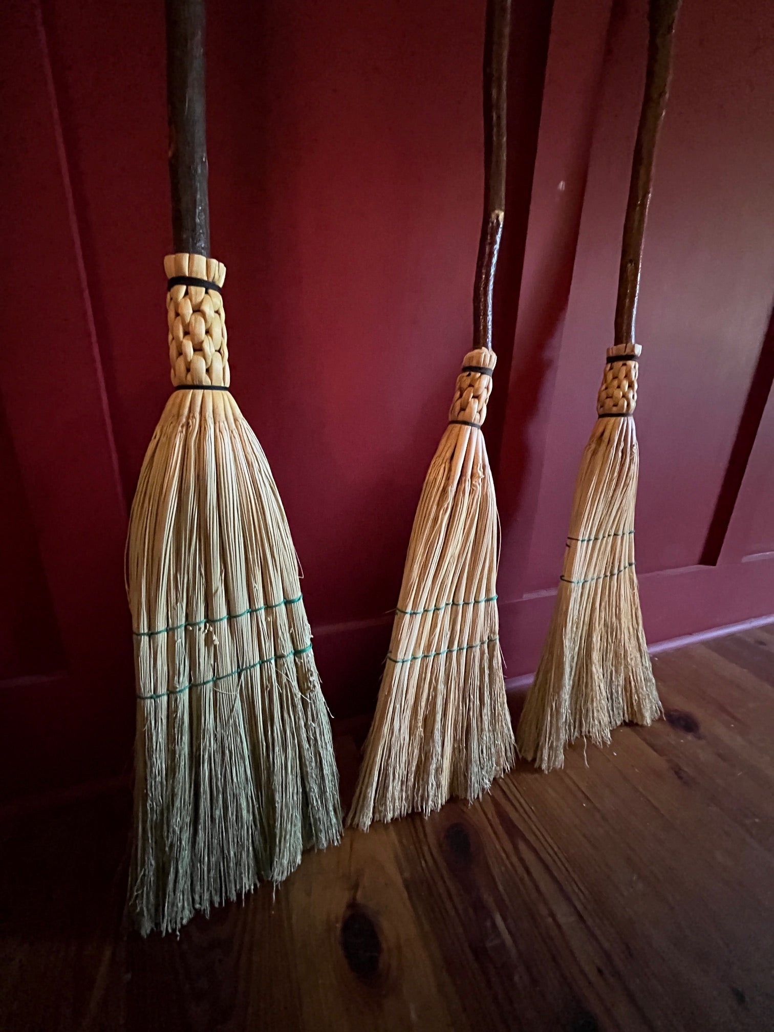 Handmade broomcorn broom on a foraged tree branch stick Old Lime Kiln
